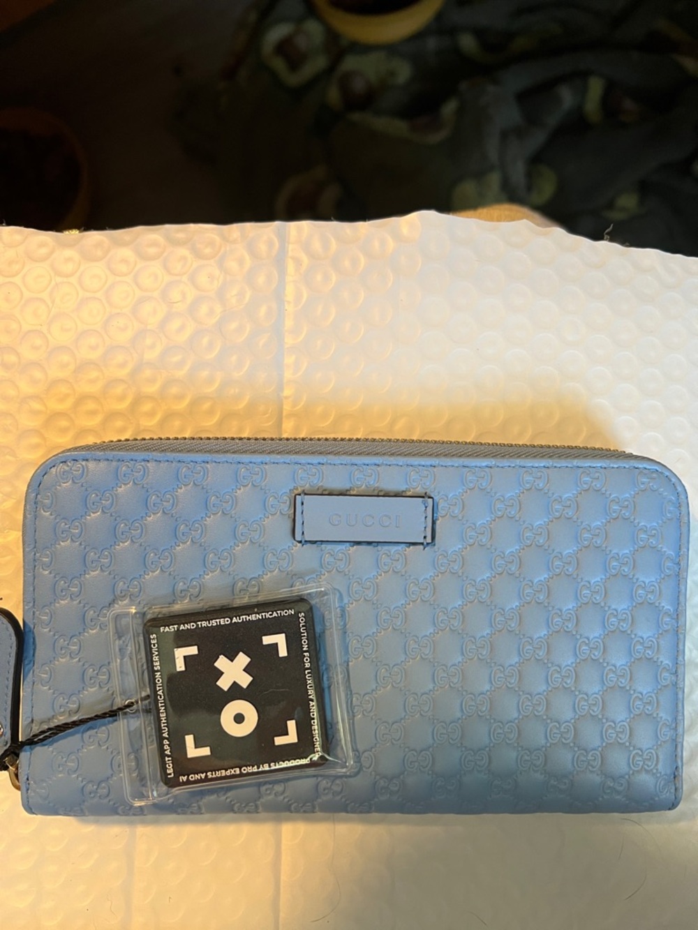 NIB Gucci Light Blue Embossed GG Zip Wallet